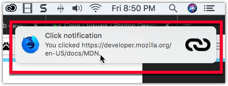 Beispiel einer Benachrichtigung auf macOS, unterhalb der Systemuhr, mit einem fettgedruckten Titel "Click notification", gefolgt von normalem Text "You clicked https://developer.mozilla.org/de/docs/MDN". Die Benachrichtigung hat das Firefox-Nightly-Logo auf der linken Seite und ein Link-Symbol auf der rechten Seite.